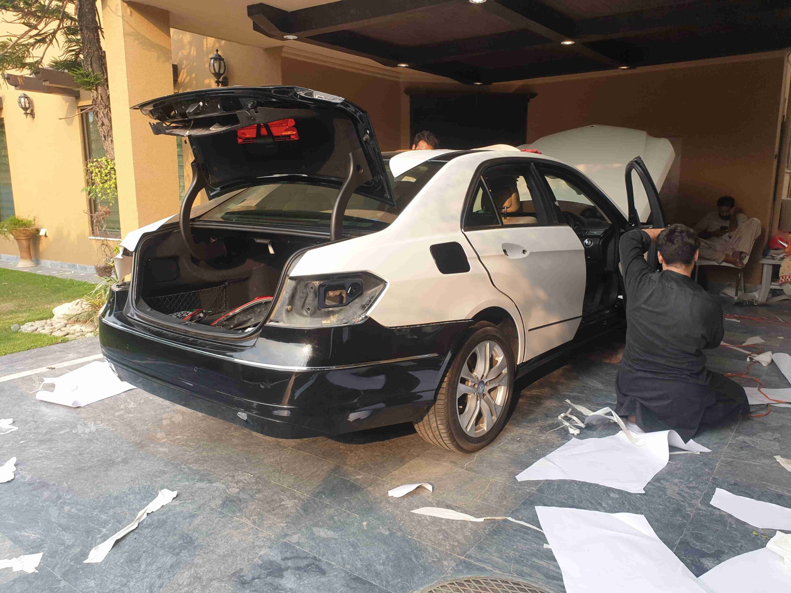 asif car wrap's team working on the car